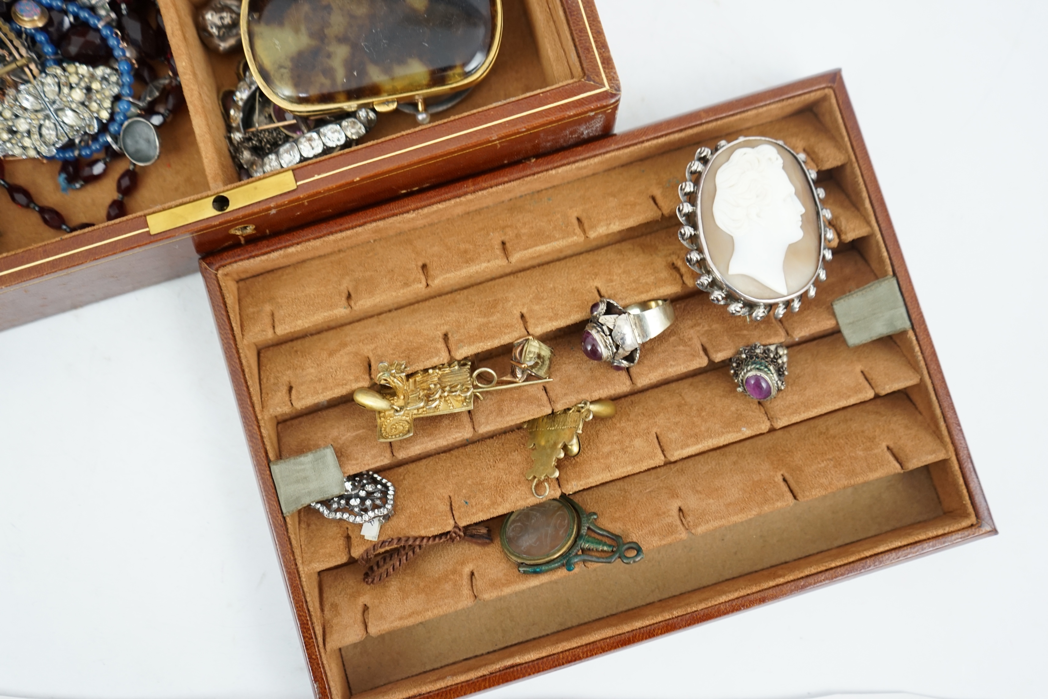 A quantity of 19th century and later jewellery and other collectables, including paste set buckles, agate mounted seal, tortoiseshell purse, Victorian figural seal, coins, 9ct ring, loose stones, cameo shell brooches, et